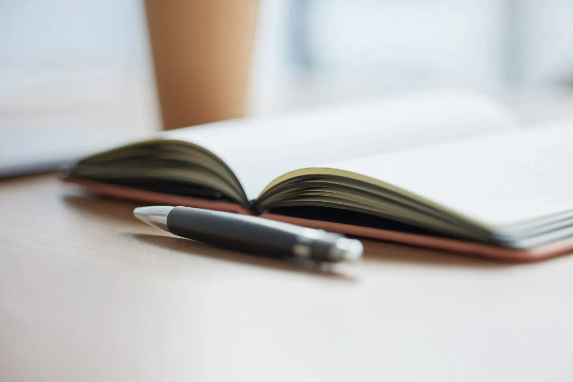 An open notebook and pen representing intentional life design